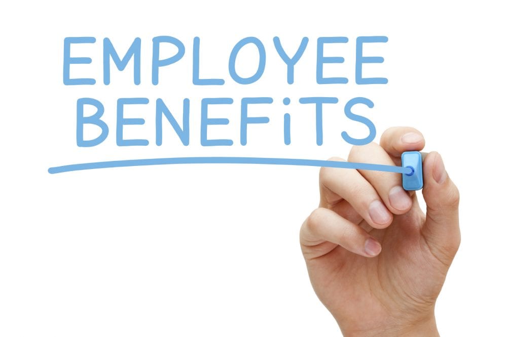 Hand writing Employee Benefits with blue marker on transparent wipe board isolated on white.